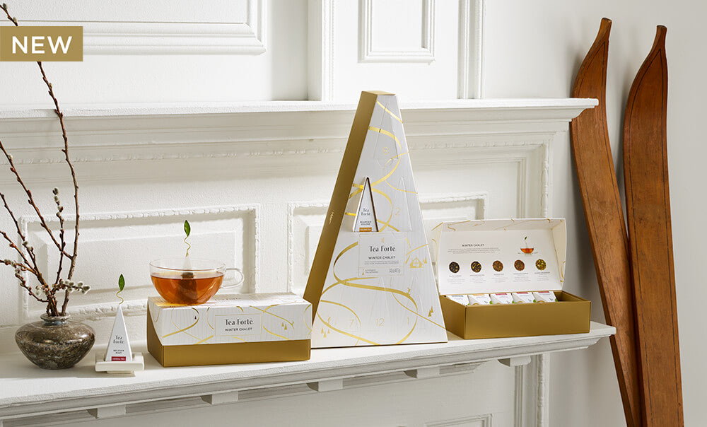 Winter Chalet Collection, boxes opened and closed on a white shelf with antique wooden skis and glass teacup